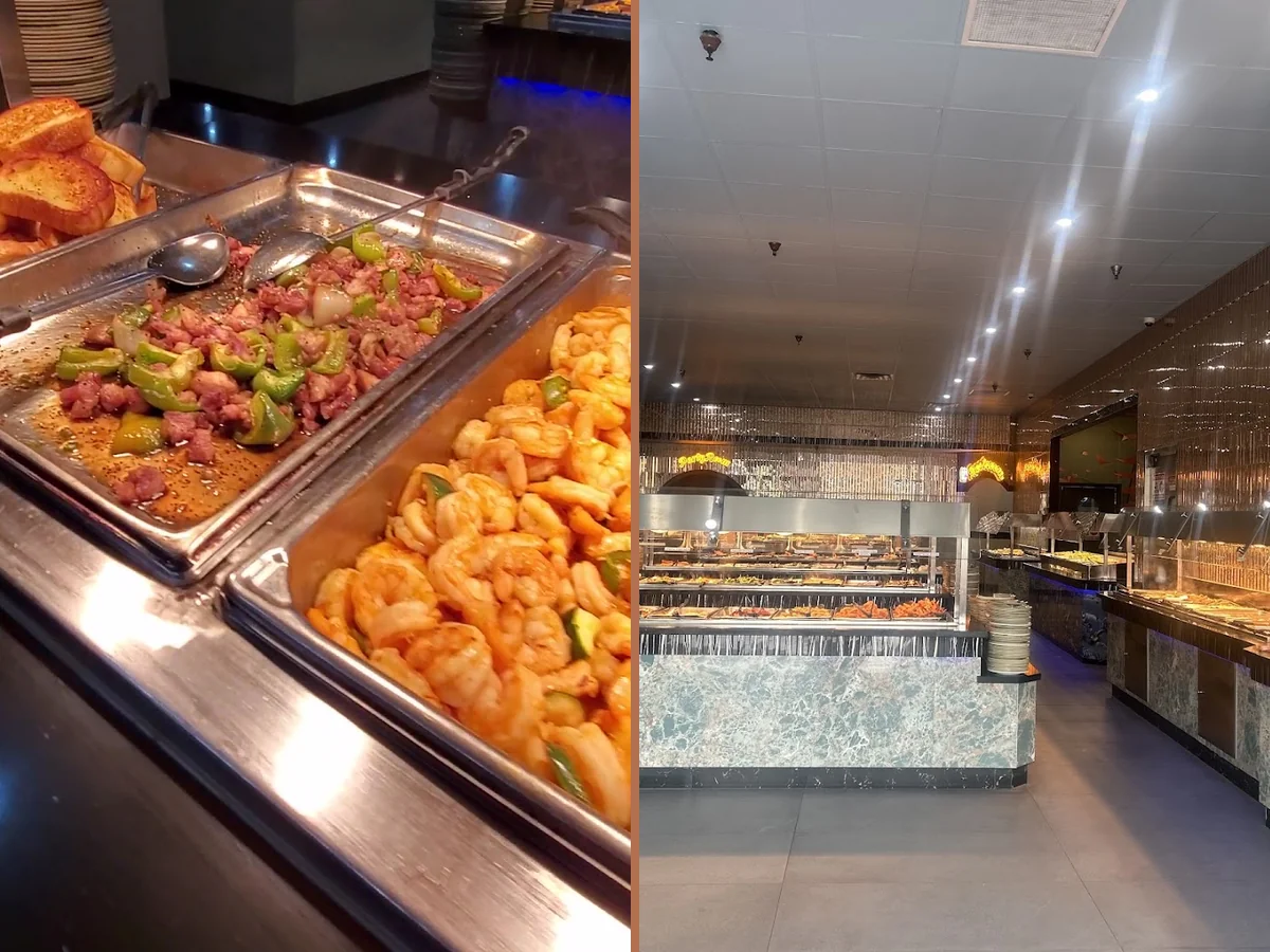 Buffet trays with Chinese dishes under warm lighting.