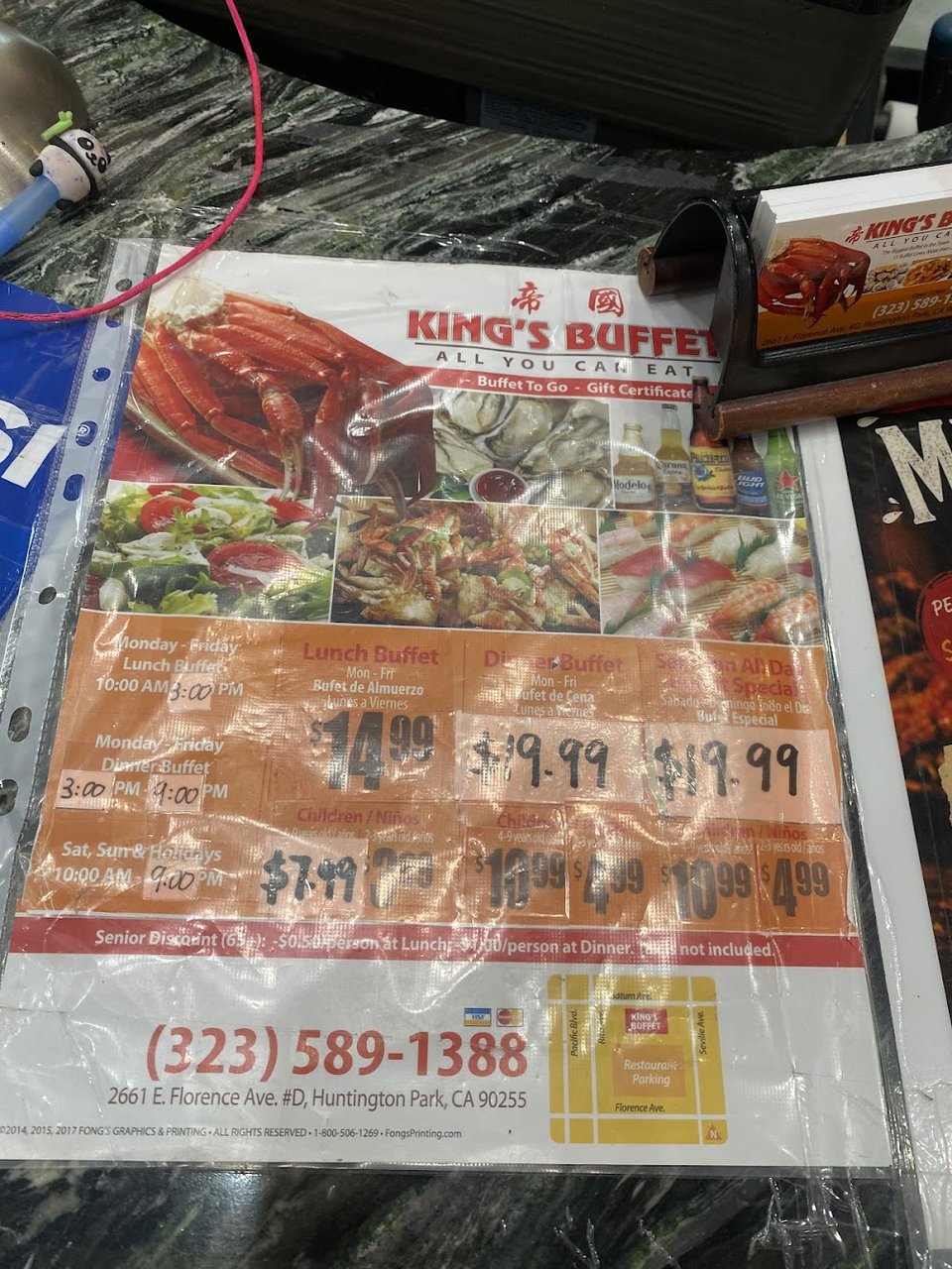 Menu board showing buffet service times.